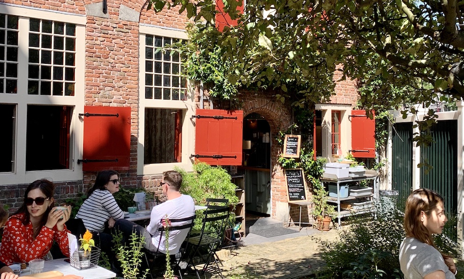 People drinking coffee on the terrace of Koffieschenkerij