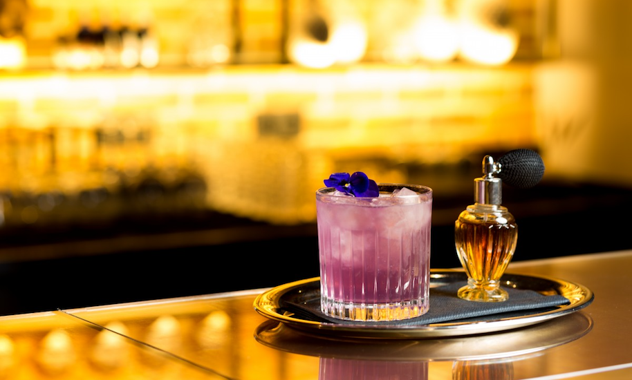 Pink cocktail served on a silver tray in the cocktail bar The Tailor